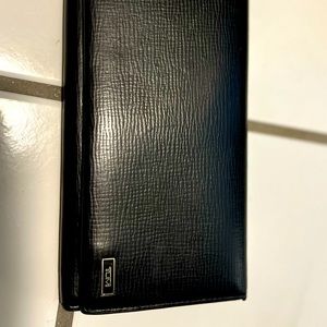 Tumi black long wallet